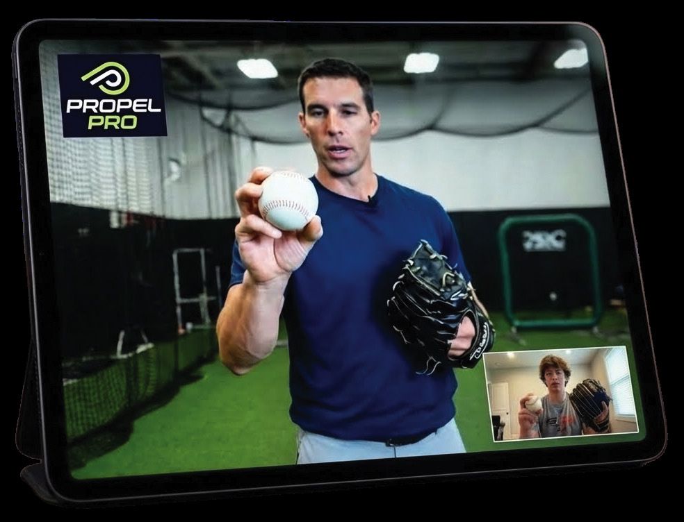A coach provides virtual instruction to a young player on a tablet using the Propel Pro platform.